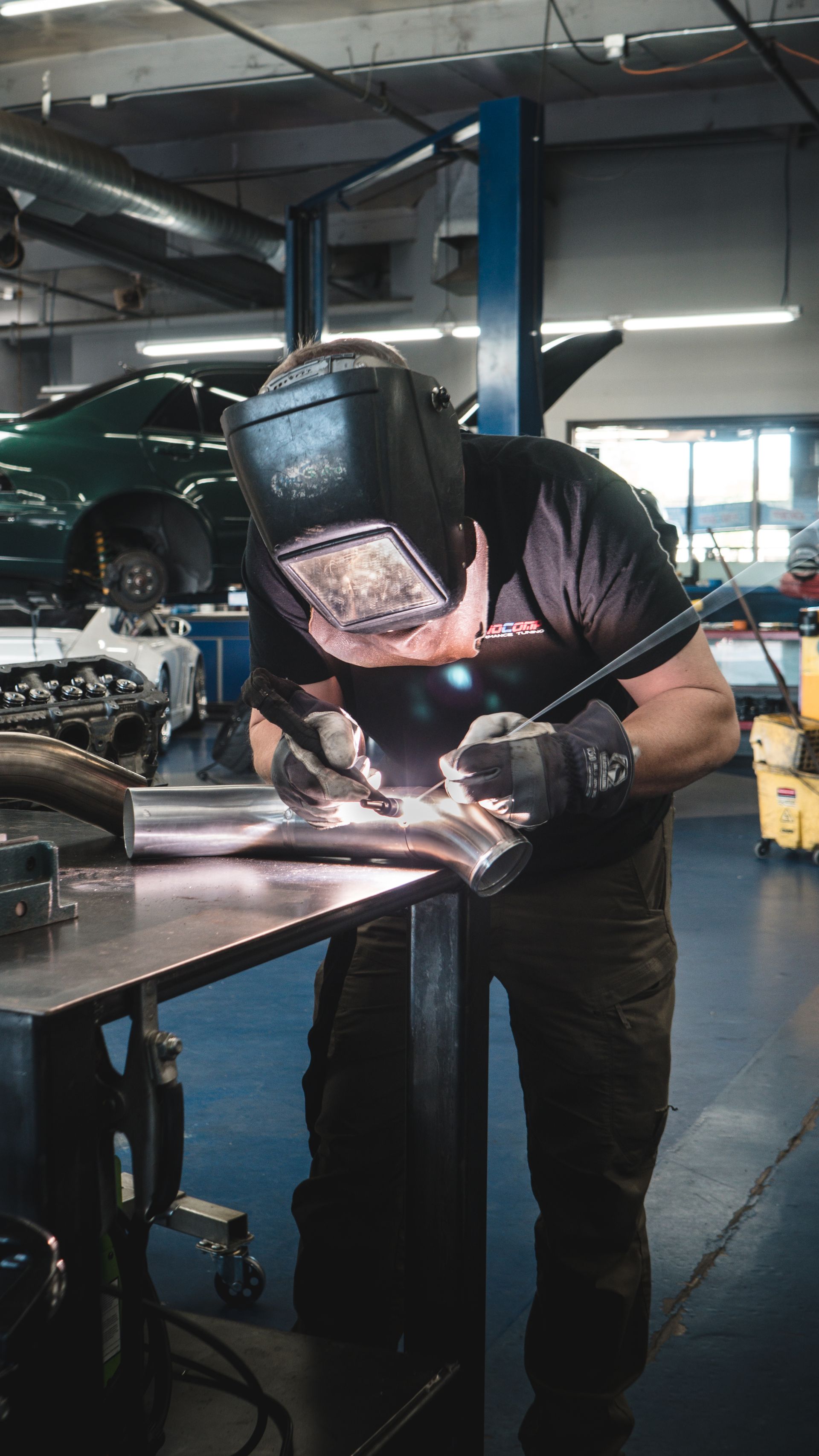 Our mechanic is welding a vehicle's part in Scottsdale, AZ | Dyno-Comp