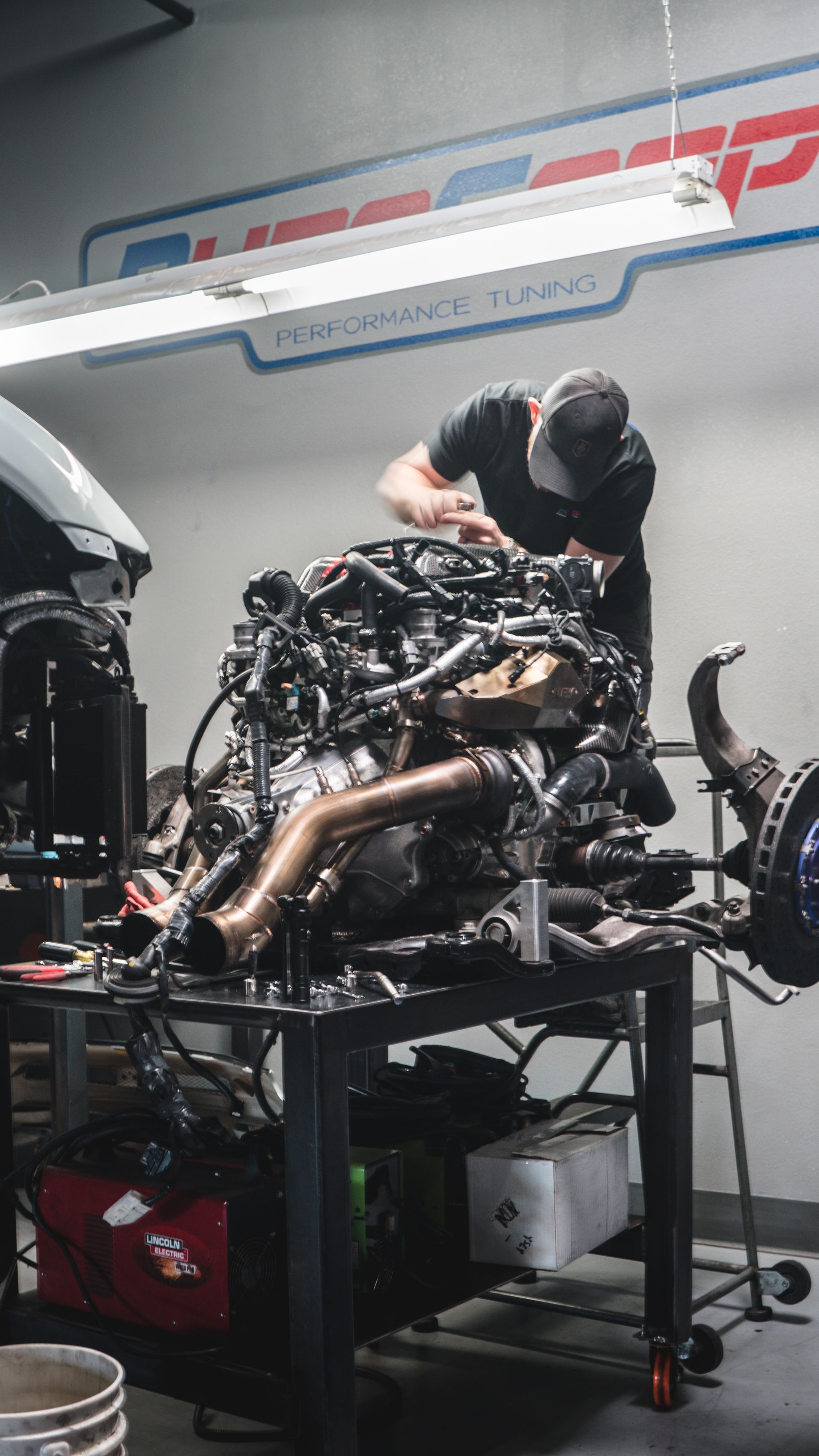 Our technician is working on customizing the vehicle's engine in Scottsdale, AZ | Dyno-Comp