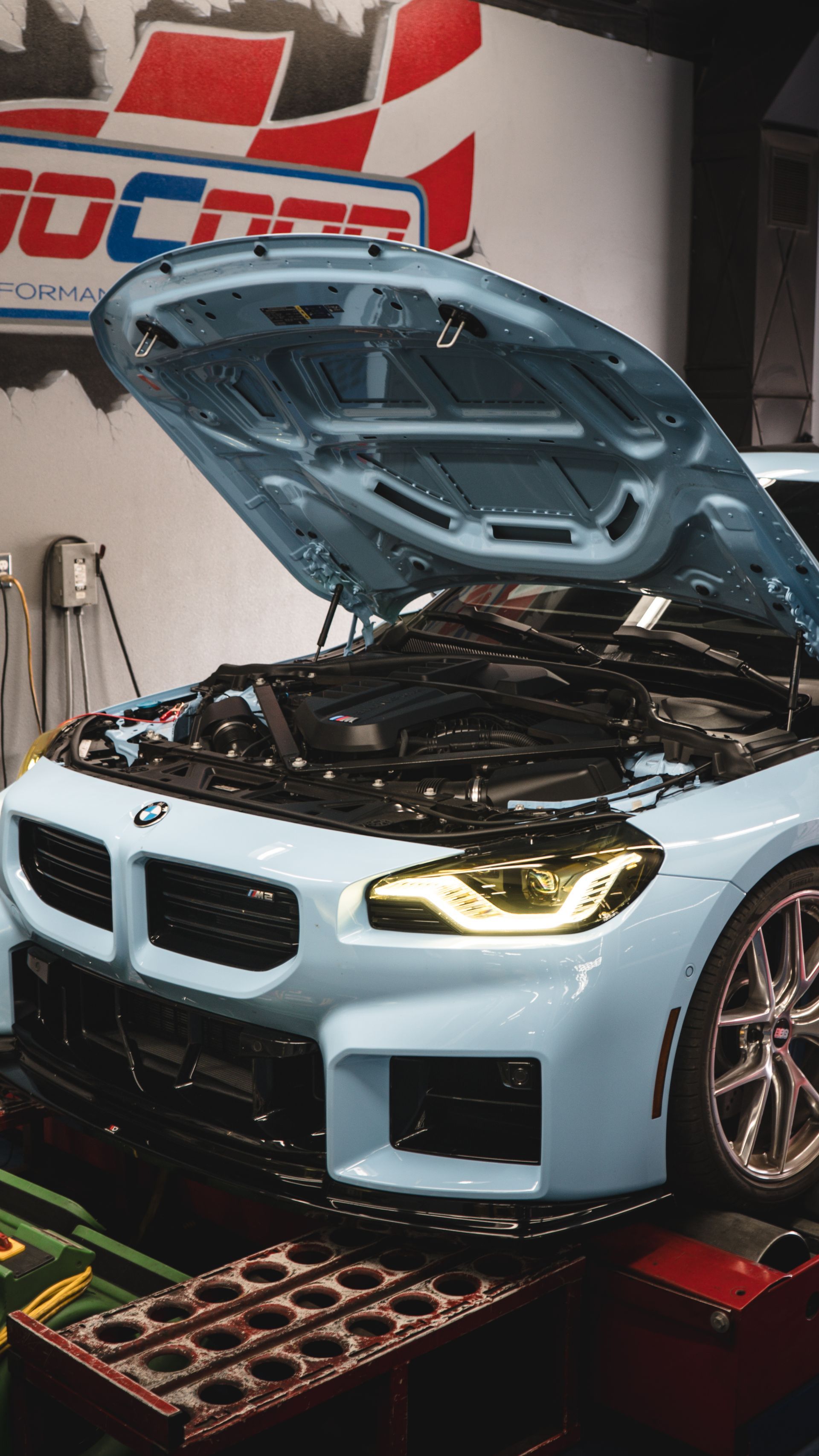 A white BMW with opened hood in Scottsdale, AZ | Dyno-Comp