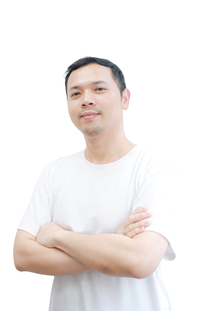 a man in a white shirt is standing with his arms crossed .