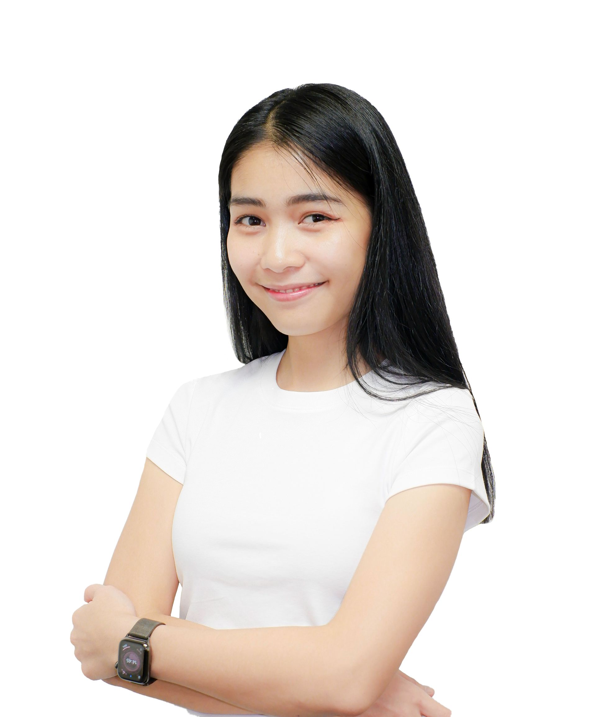 a young woman wearing a white shirt and a watch is standing with her arms crossed .