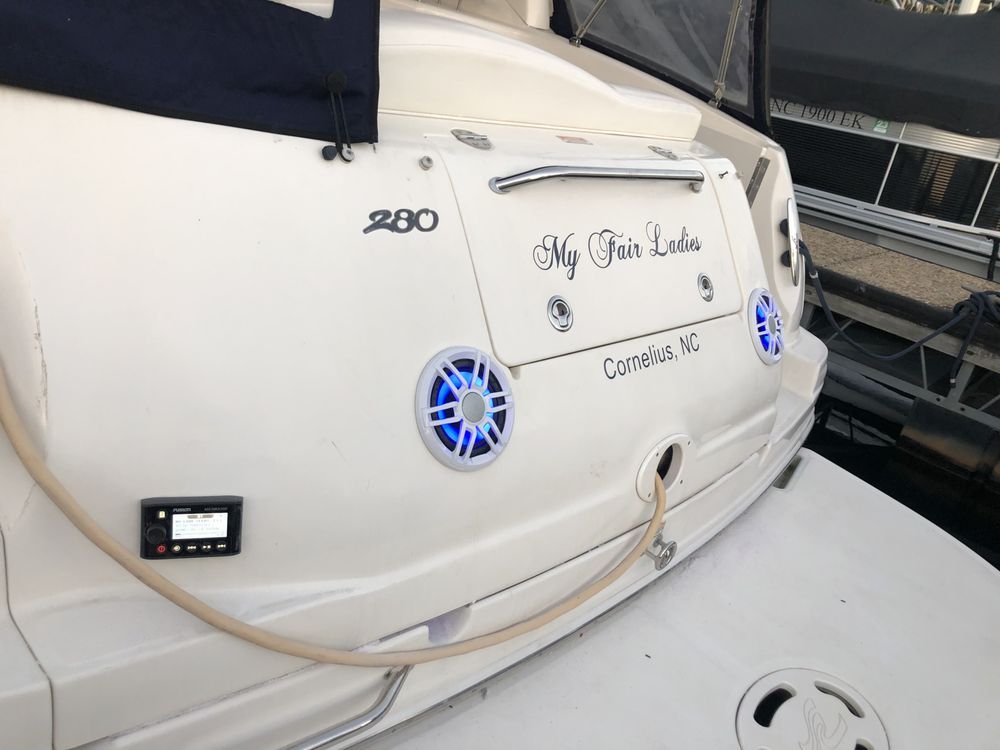 A white boat with the name my fair lady on the back