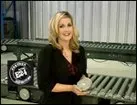 Woman is standing in front of a Conveyor Belt - Lynchburg, VA - Electro Mechanical Handling Inc