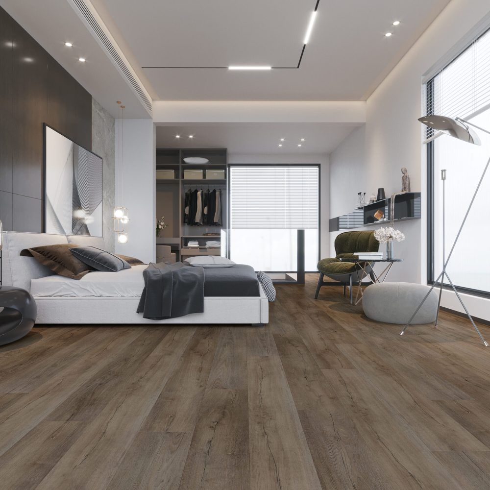 Modern bedroom with a white bed, dark wood floor, and walk-in closet.