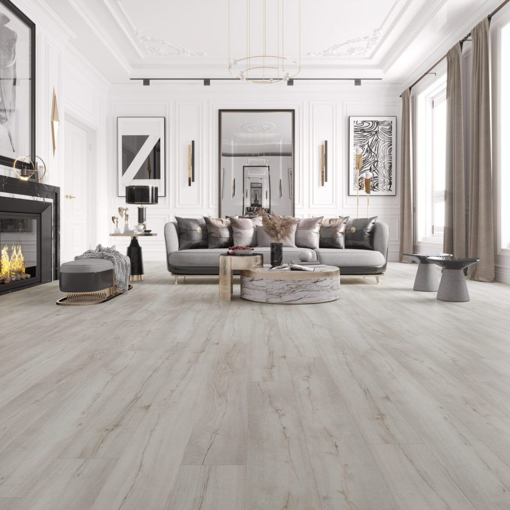 Living room with gray sofa, fireplace, and light wood-look flooring.