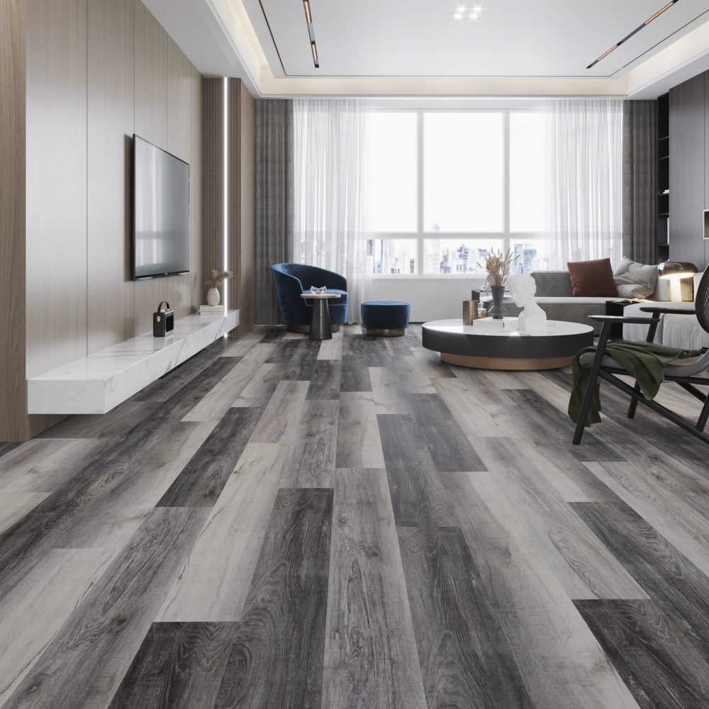 Living room with gray wood floors, a large window, and modern furniture.