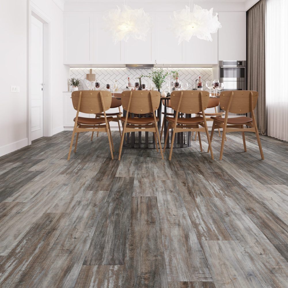 Dining room with wood-look flooring, light-colored walls, and a table set for a meal.