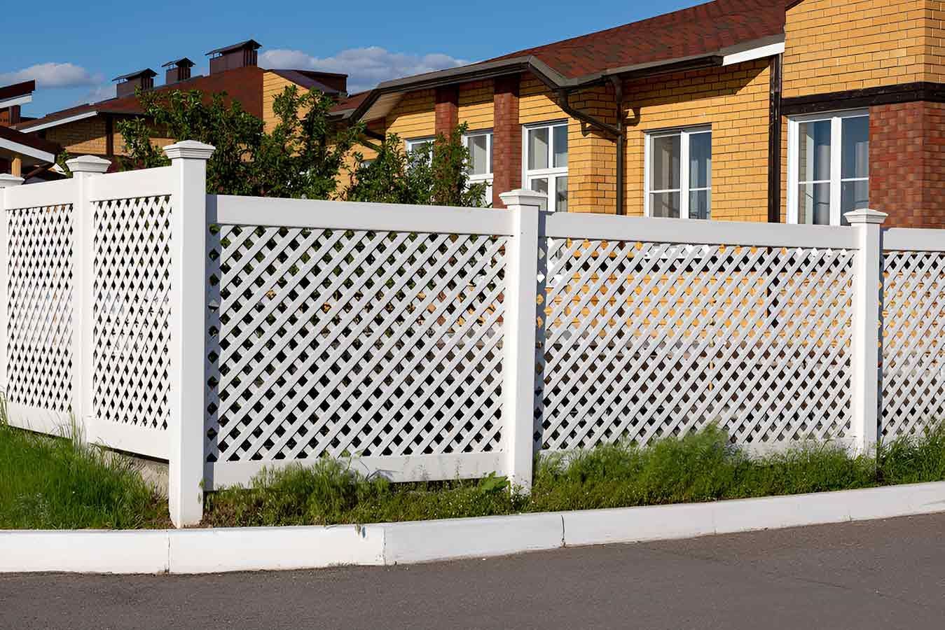 A White Lattice Fence is in Front of a Brick House — 2 Deadly Timber & Lattice in Cairns, QLD
