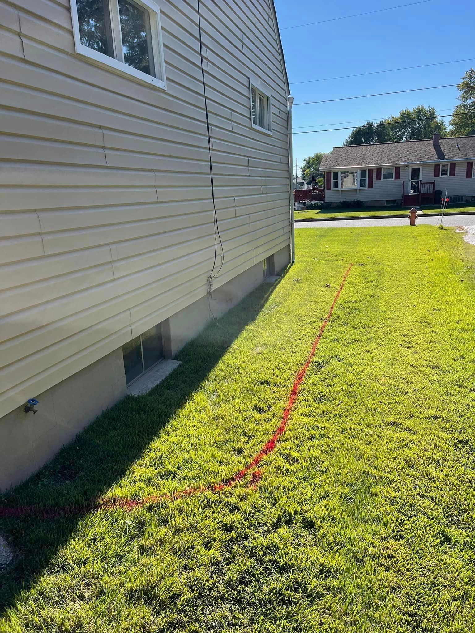 A house with a red line on the side of it.