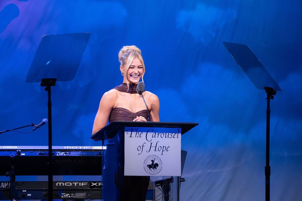 Dancing with the Stars pro and T1D advocate Rilee Arnold on stage speaking.