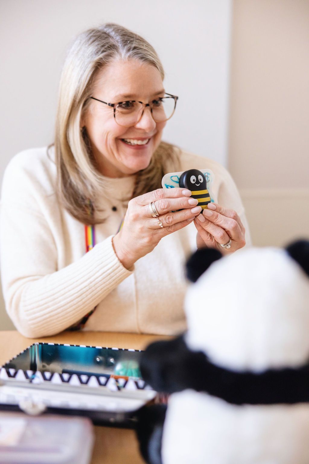 Social worker using toys and props to work with young type one diabetes patient. 