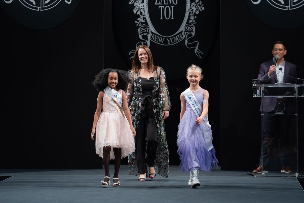 young black girl and young white girl t1d advocates on the runway with a female doctor from the BDC