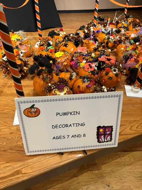 decorated pumpkins on stage for a contest