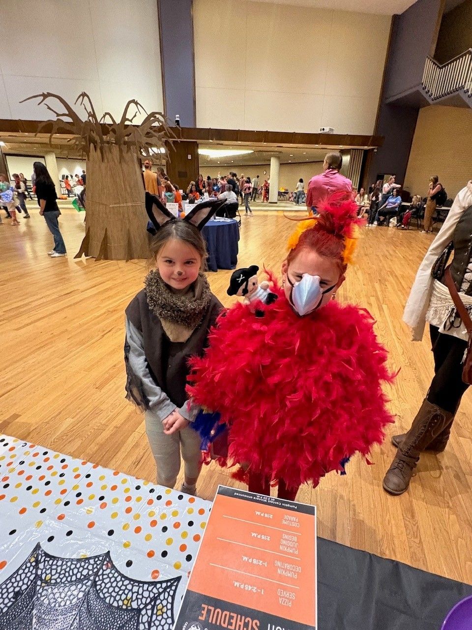 two young girls dressed as a bunny and a parrot for Halloween