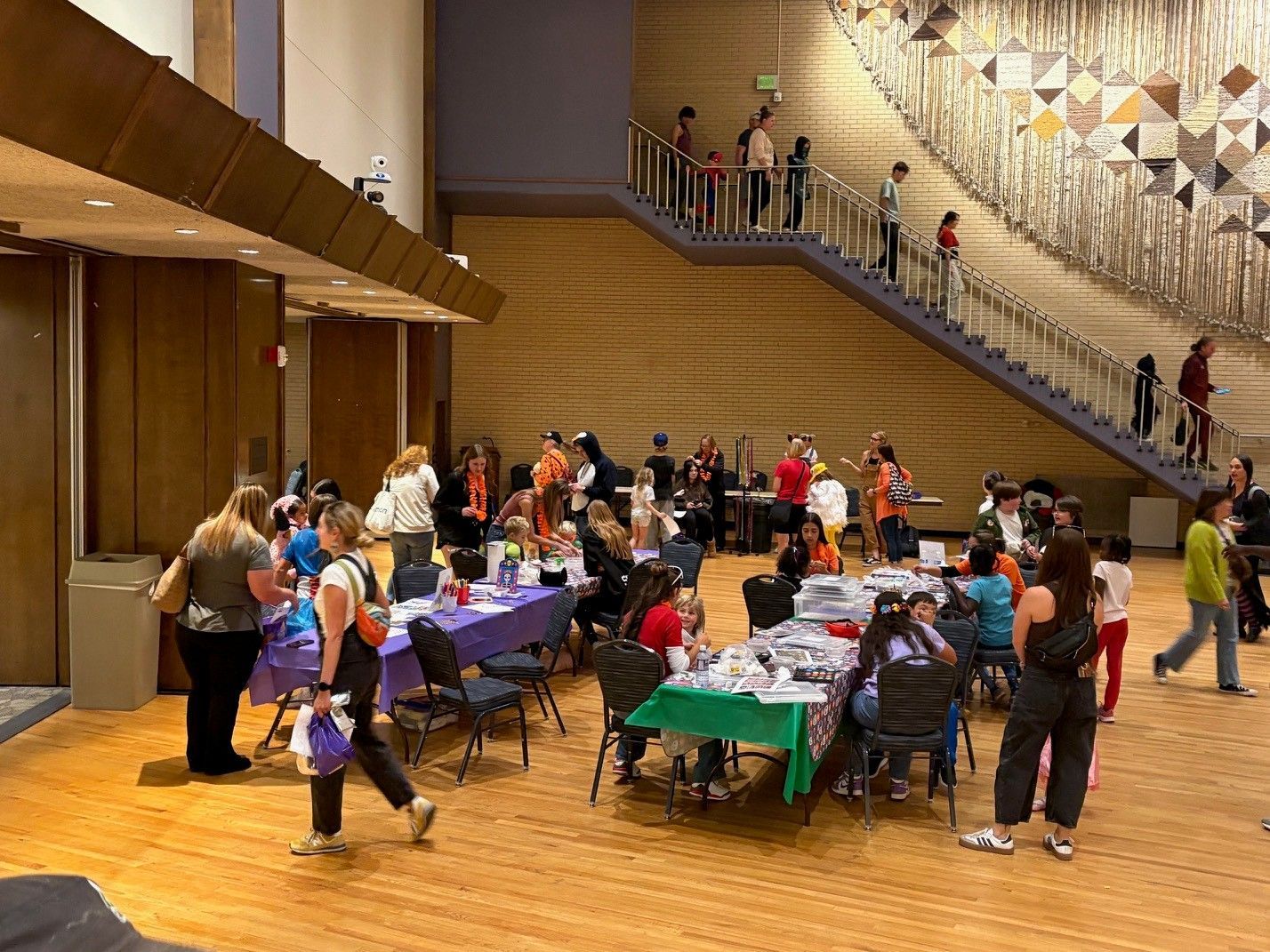 tables of kids getting their faces painted