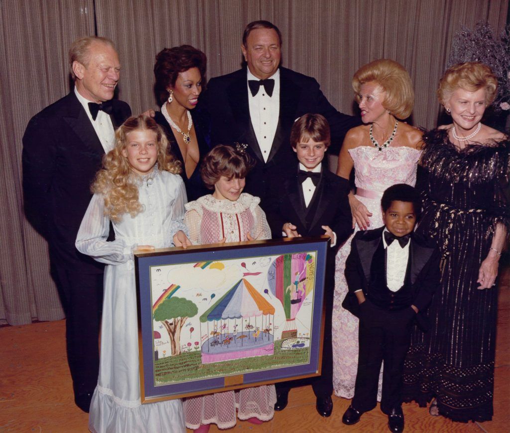 Katie (center) at the Carousel Ball with President Gerald Ford, Altovise Davis, Marvin Davis, Barbara Davis, and Gary Coleman.