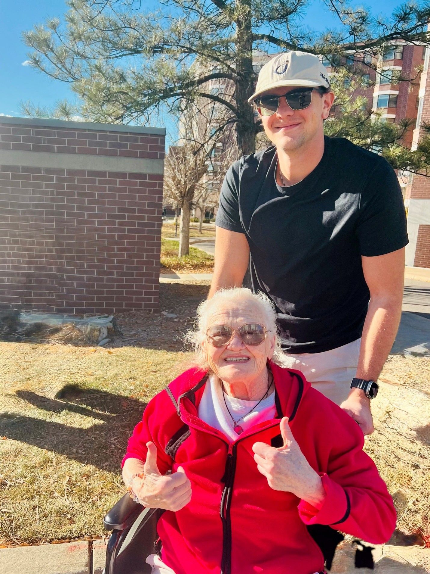 Author Wyatt Adams pushing his grandmother in a wheel chair