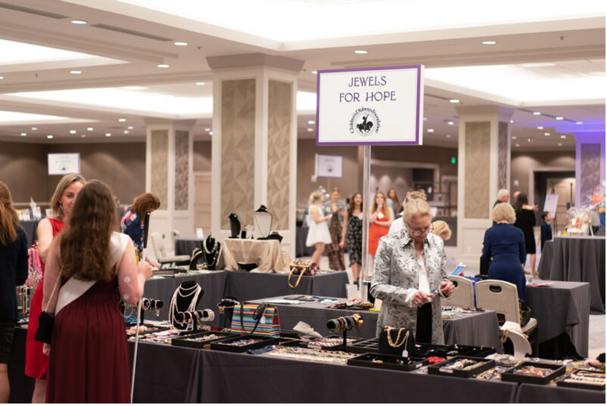 BRL Attendees shopping at the Jewels for Hope booth during the silent auction.
