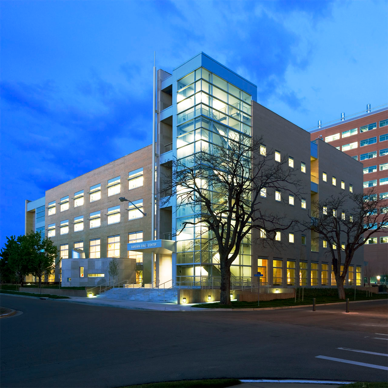 Photo of the outside of the Barbara Davis Center at night.