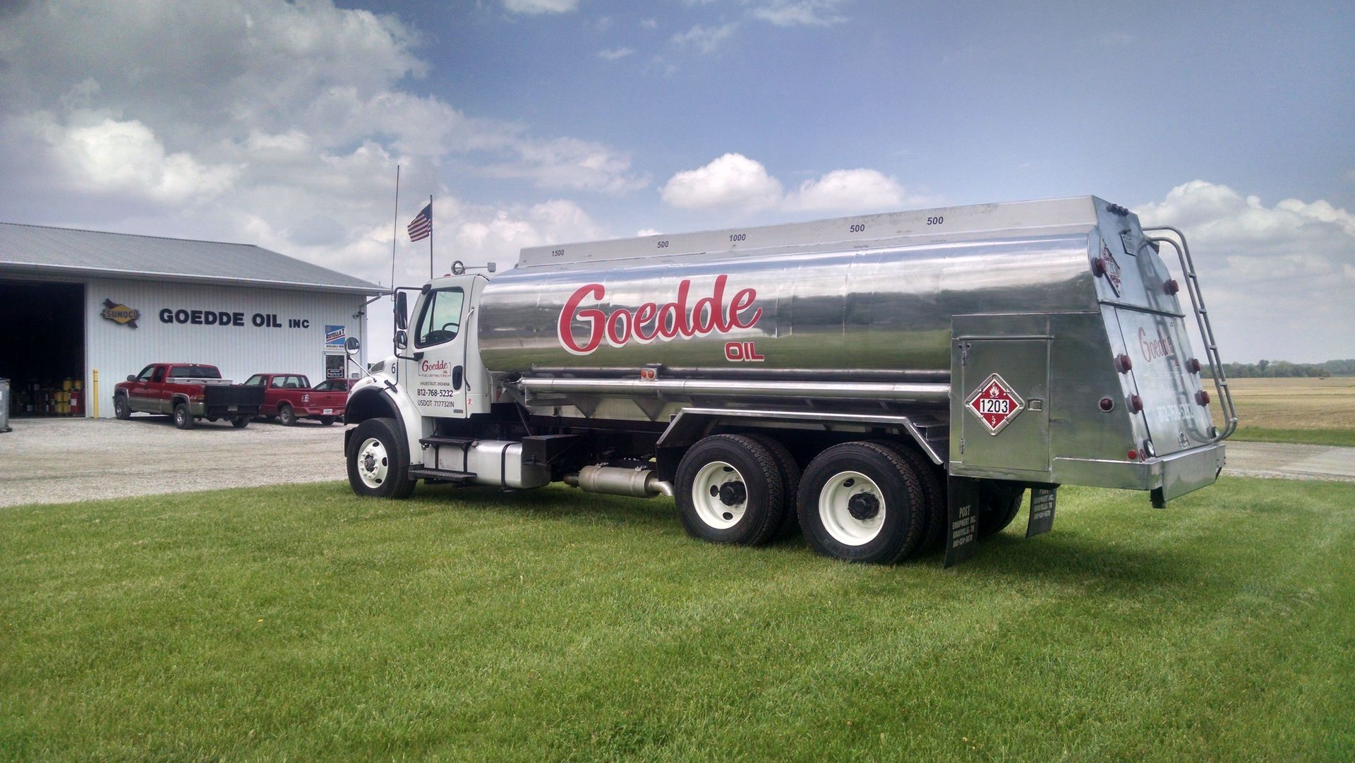 A tanker truck is driving down a highway.