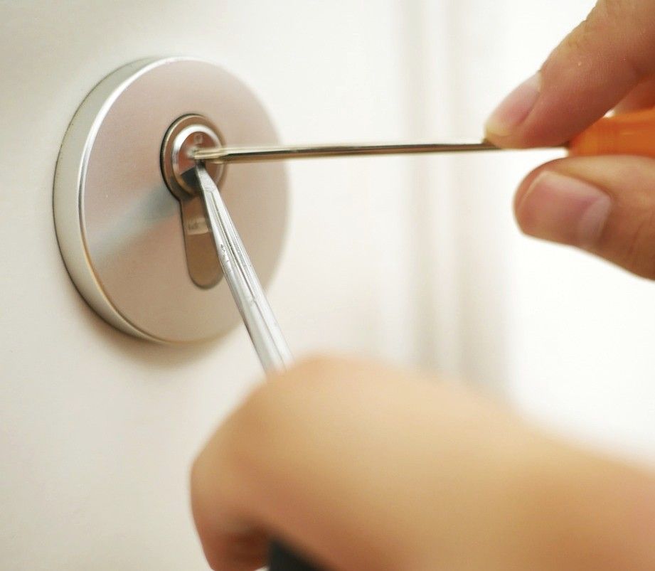 A circular lock being picked.