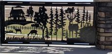 Metal gate with cut-out landscape scene featuring a house, deer, and trees.