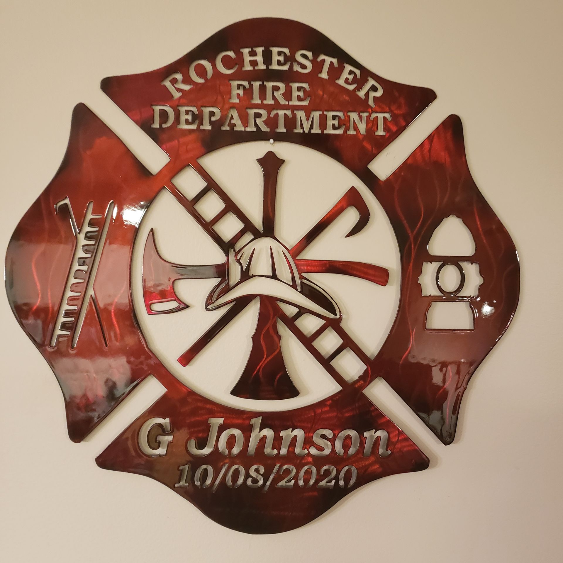 Metal fire department emblem with the words 