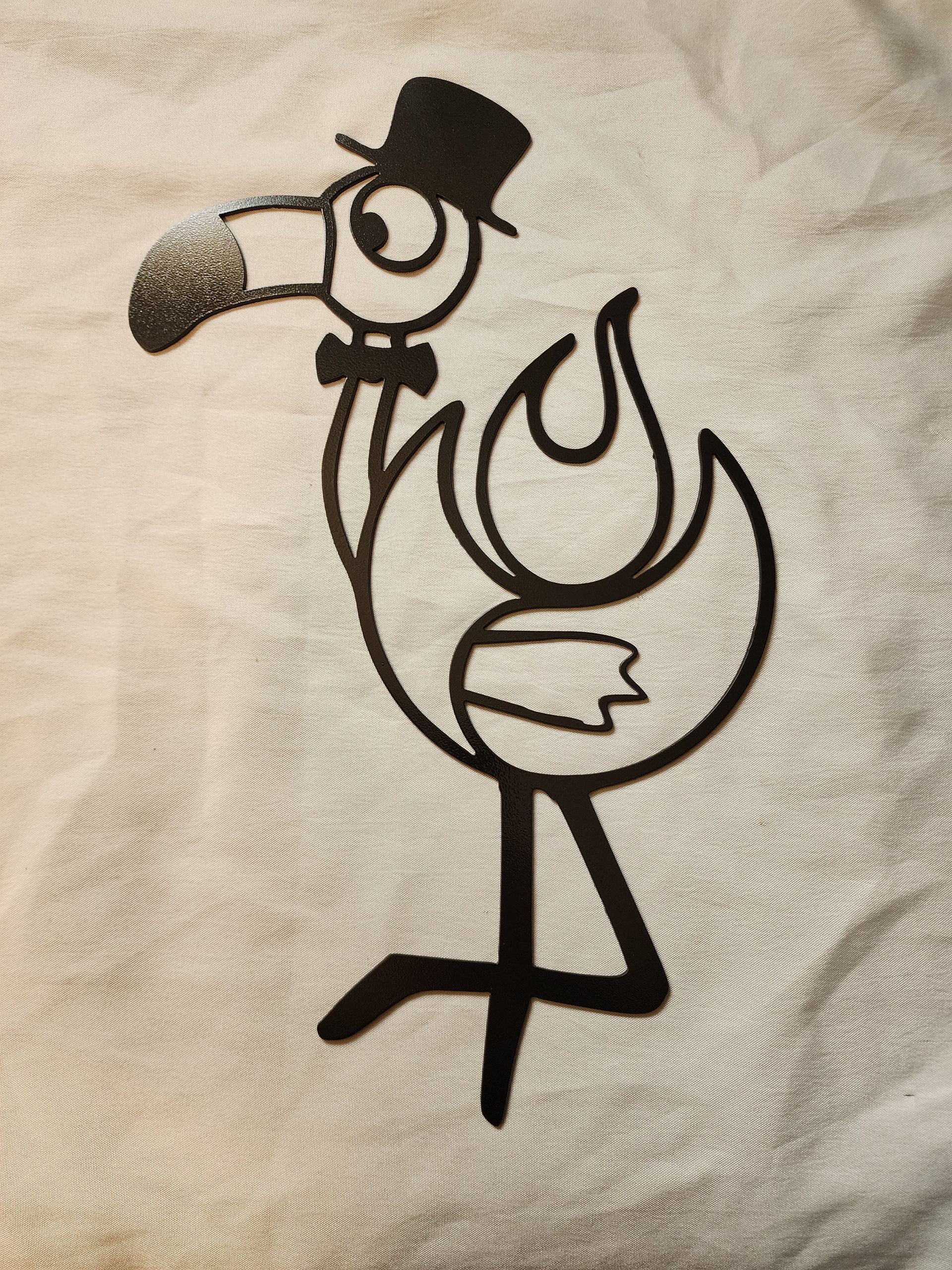 Stylized flamingo with top hat and bow tie.