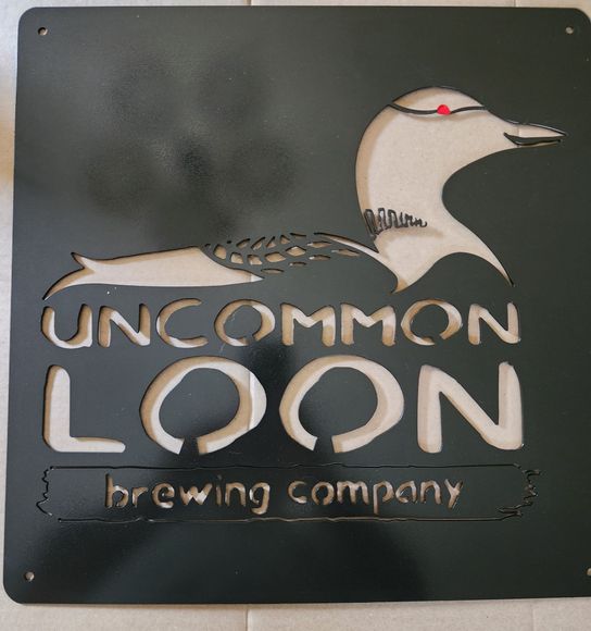 Black metal sign of a loon, the words