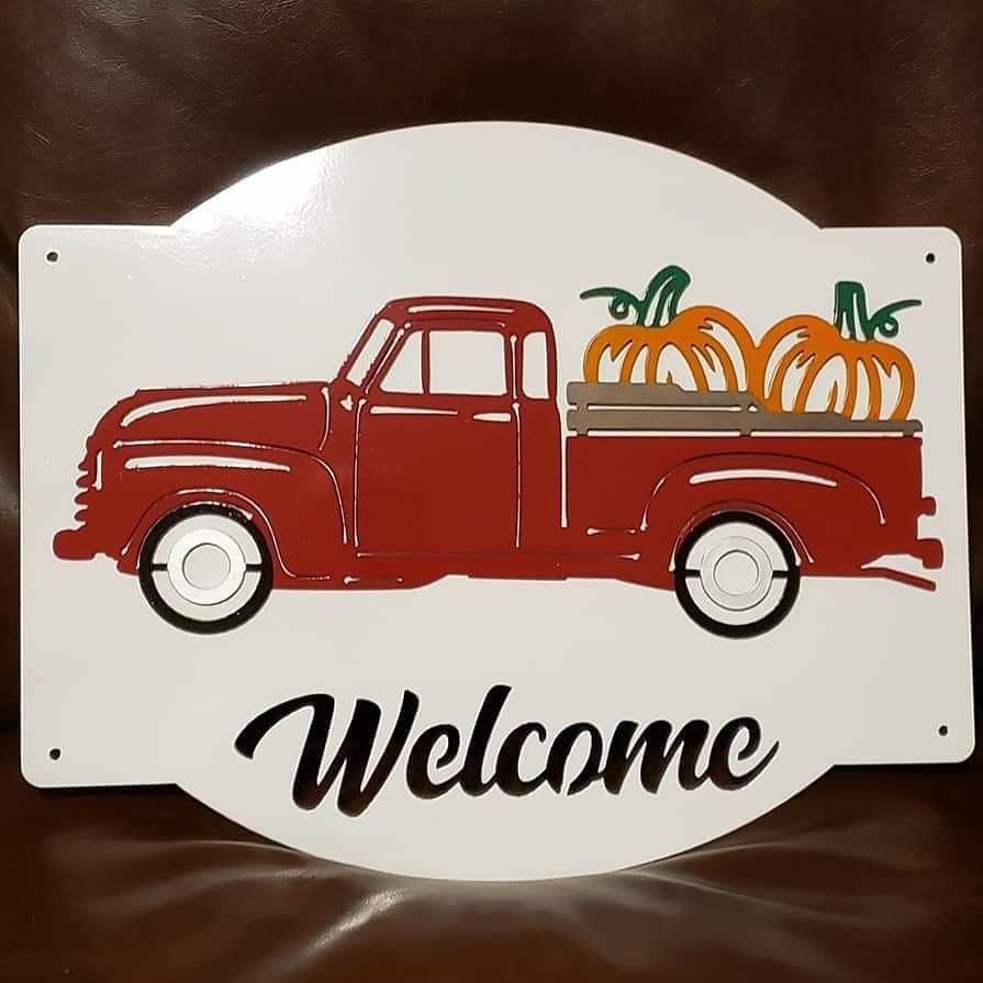 Red truck carrying pumpkins, 