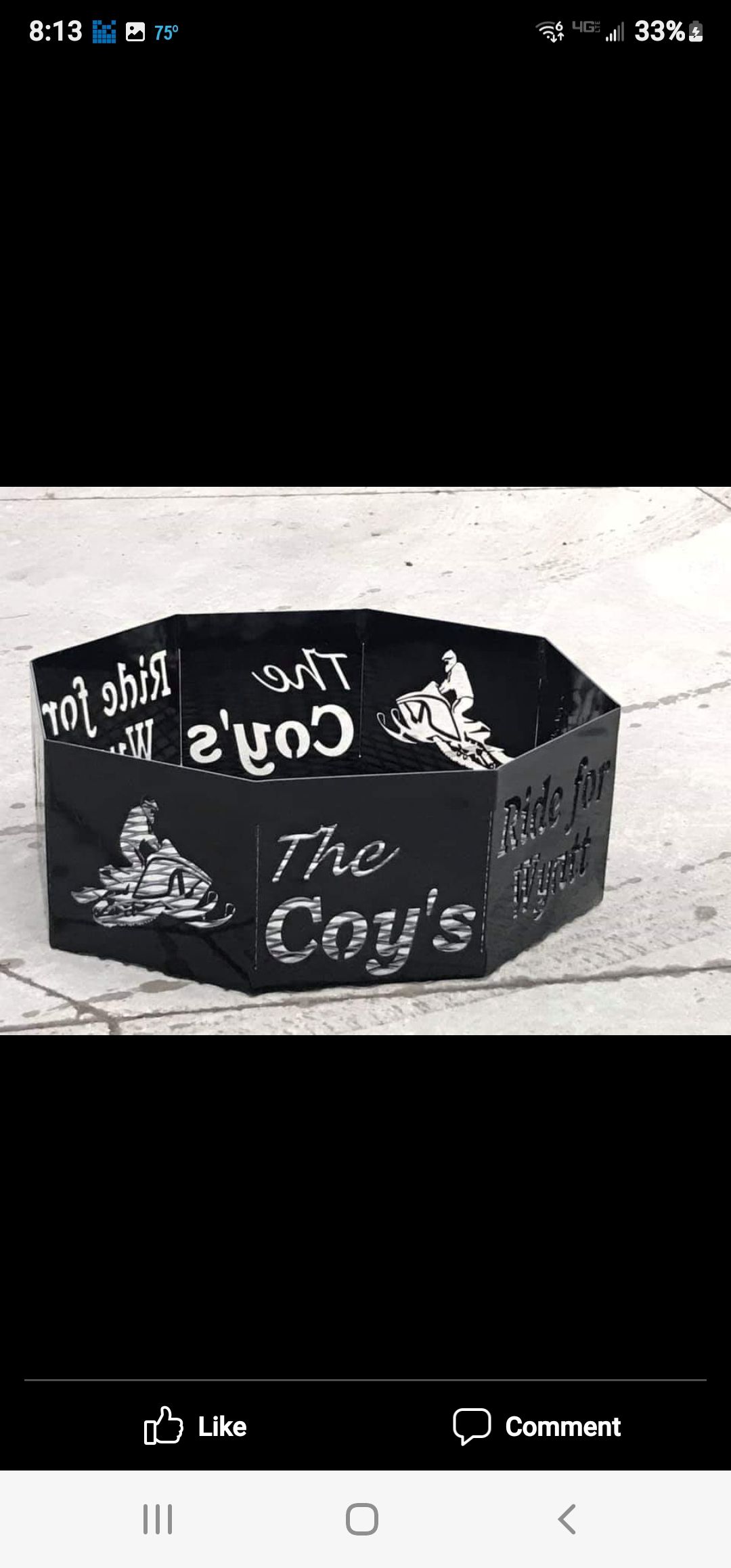A black, hexagonal metal fire pit with 