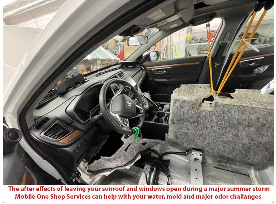 Image of  2017 Honda Pilot with the sunroof and windows open during a massive summer storm