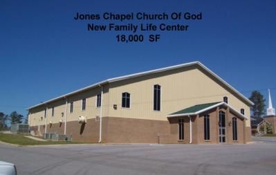 Jones Chapel Church of God new family life center, beige and brown building with tall windows, blue sky.