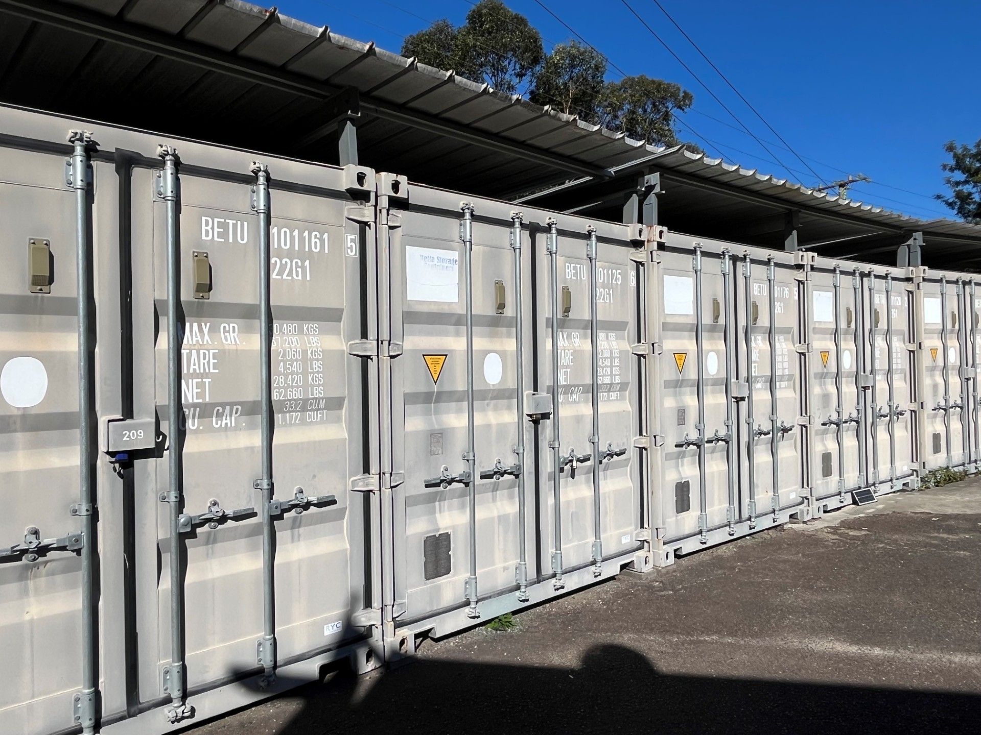 A Row of Storage Containers Are Lined Up  — Teralba Business & Storage Park in Teralba, NSW