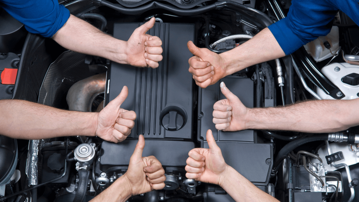 mechanics giving thumbs up