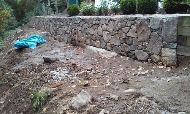 Stone Wall in Garden — Waterbury, CT — Armend's Painting and Home Improvement