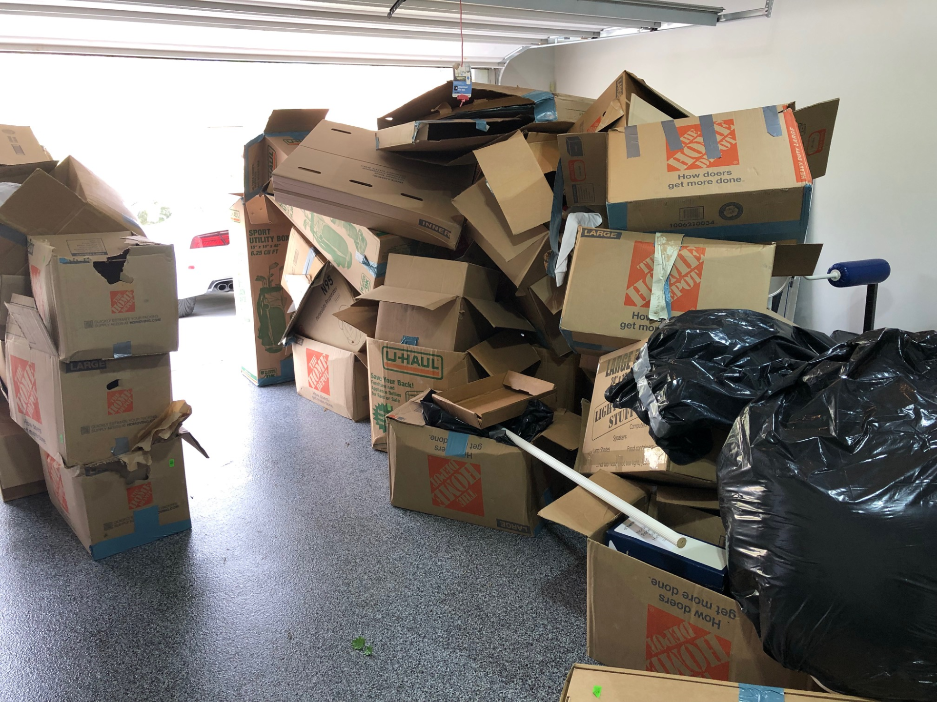 pile of cardboard boxes in a storage room