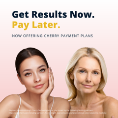 two beautiful women are standing next to each other on a pink background .