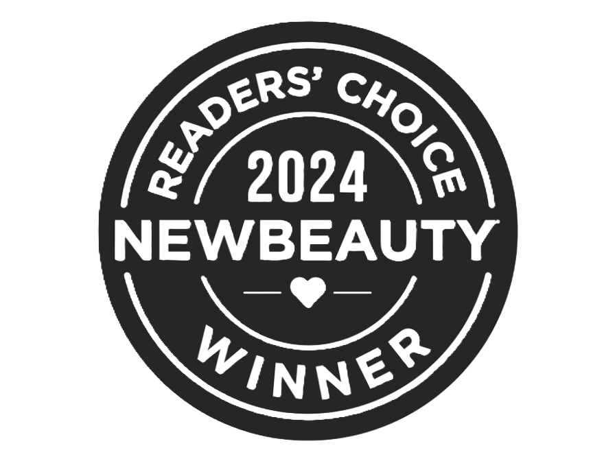 A black and white badge that says readers choice 2024 new beauty winner.