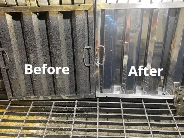 A close up of a stainless steel exhaust hood in a kitchen.