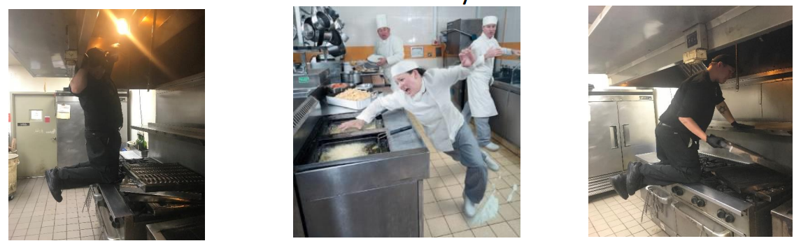 A group of people are standing in a kitchen.