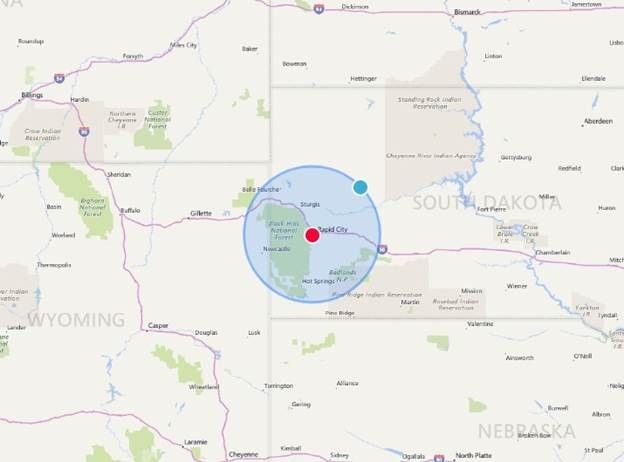 Map of South Dakota and surrounding states. A blue circle indicates Rapid City. A red dot marks its location.