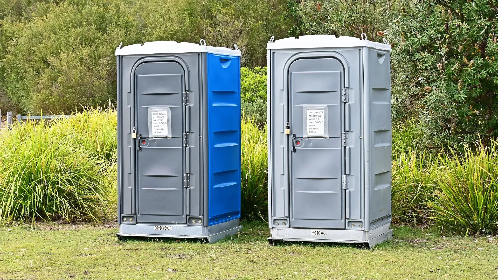 Two Blue Portable Toilet