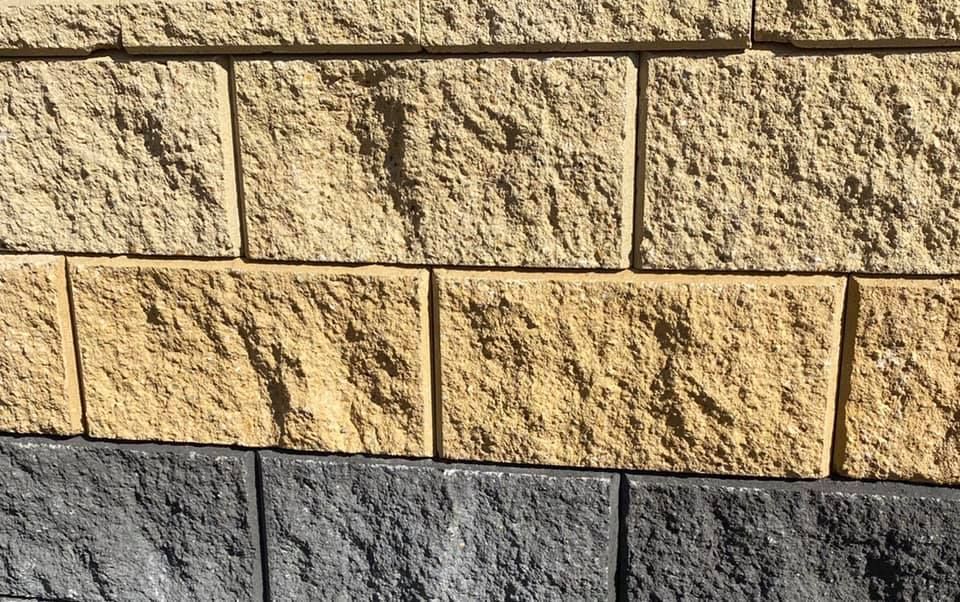 Three Rows Of Textured Blocks: Yellow, Tan, and Grey, Arranged as A Wall — Port Landscape Supplies in Port Macquarie, NSW