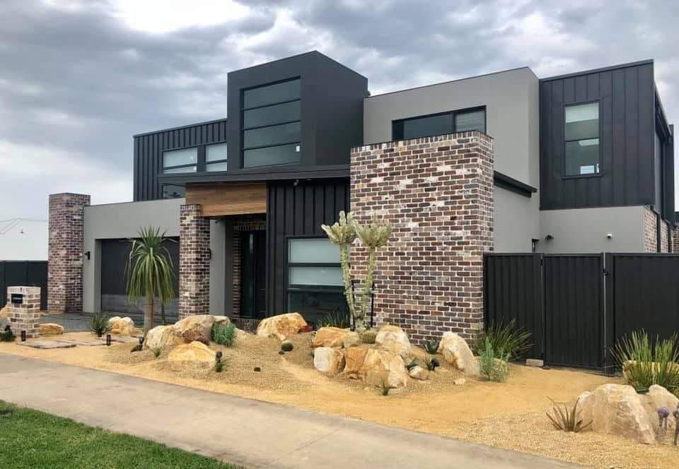 Modern Two-Story House With Dark Siding, Brick Accents — Port Landscape Supplies in Port Macquarie, NSW