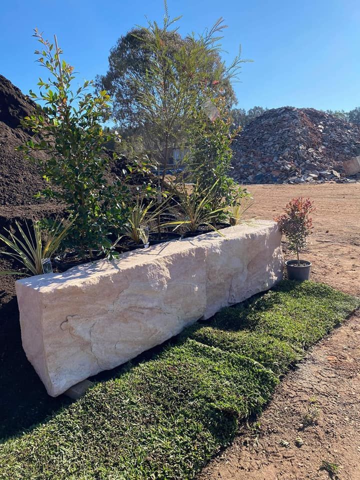 Large Rectangular Beige Stone Planter Filled With Greenery — Port Landscape Supplies in Port Macquarie, NSW
