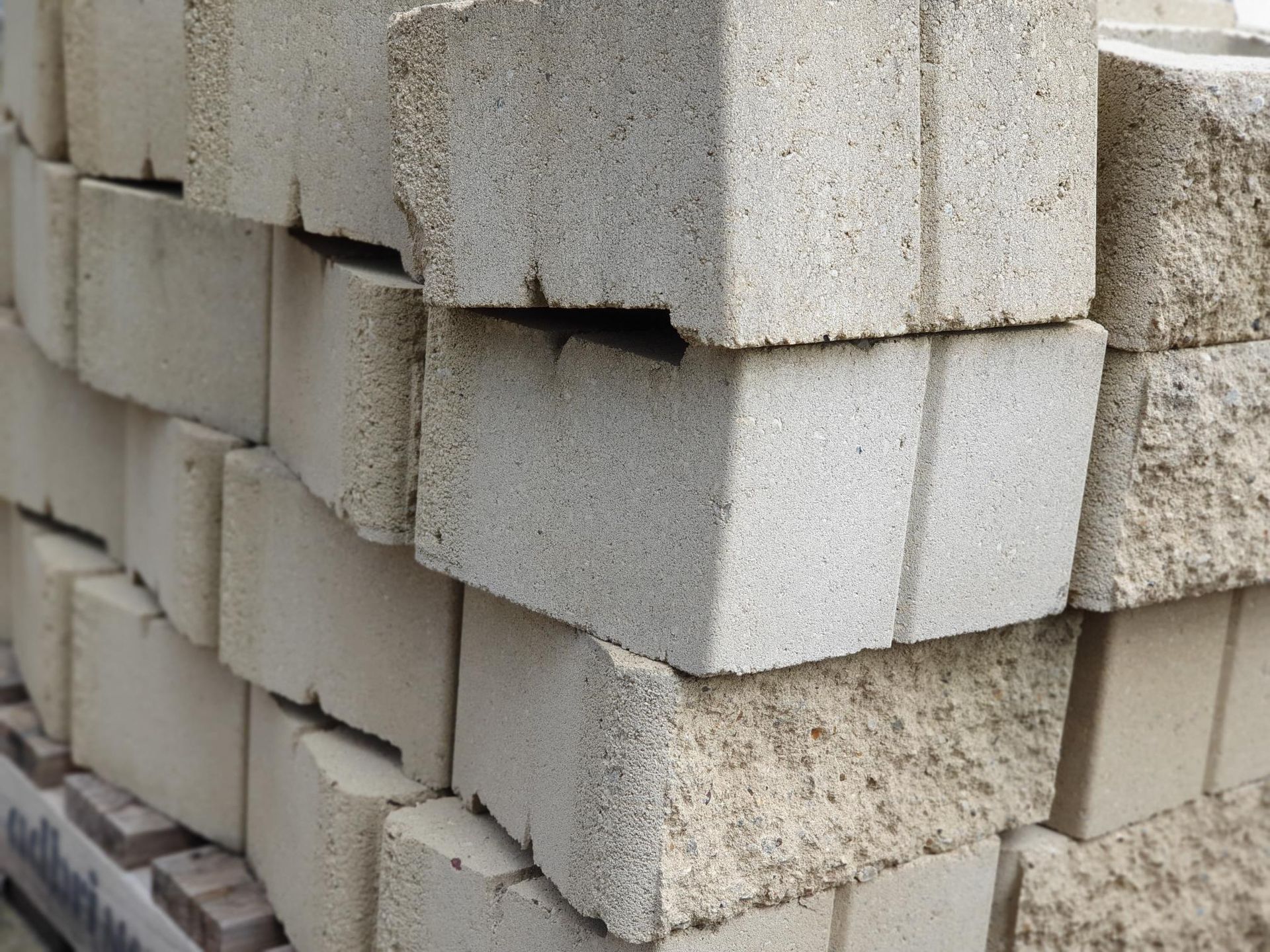 Stack Of Light-Coloured, Rectangular Blocks With Textured Surfaces — Port Landscape Supplies in Port Macquarie, NSW