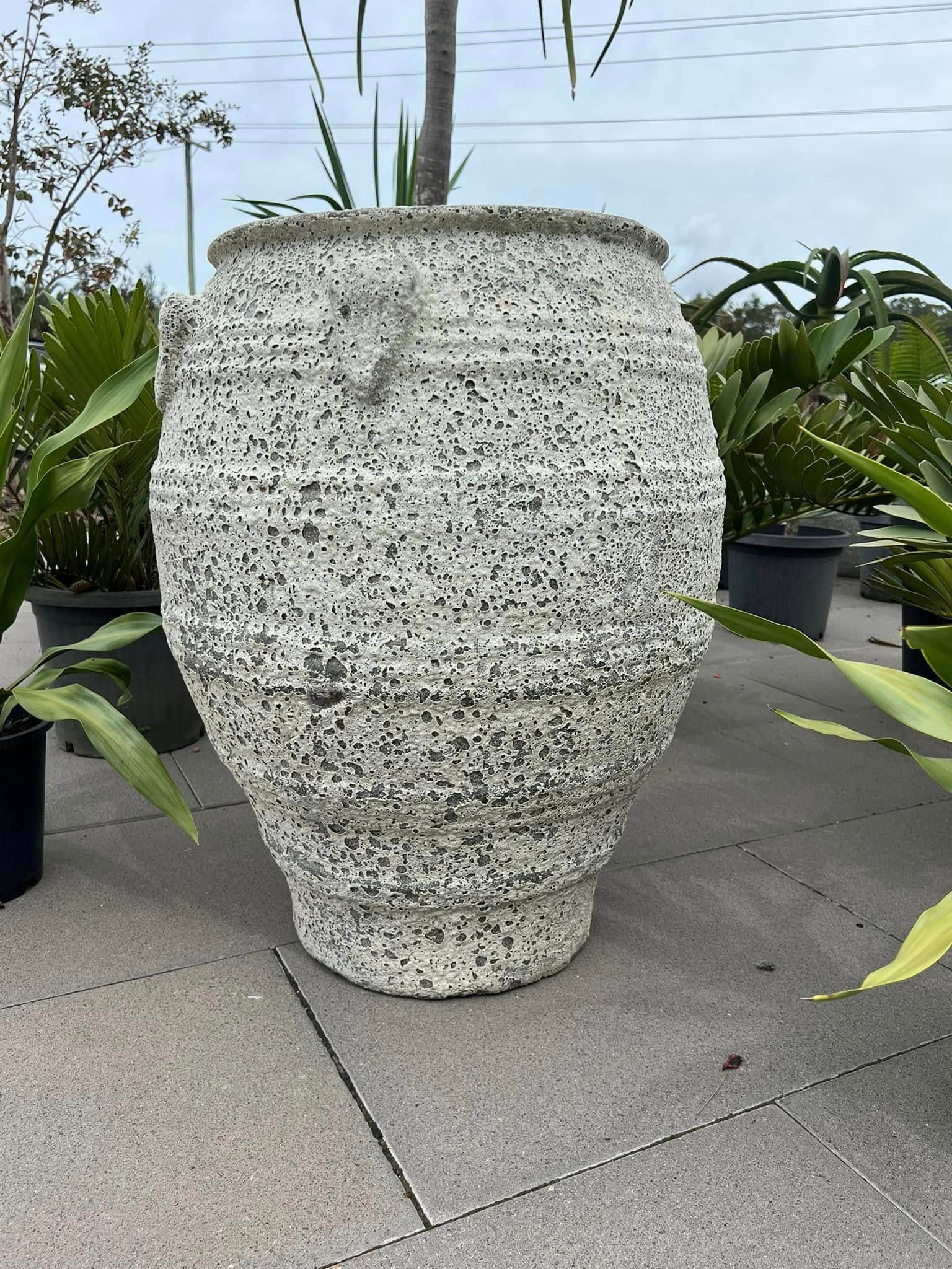 Large Textured White Outdoor Planter with Plants in A Nursery Setting — Port Landscape Supplies in Port Macquarie, NSW