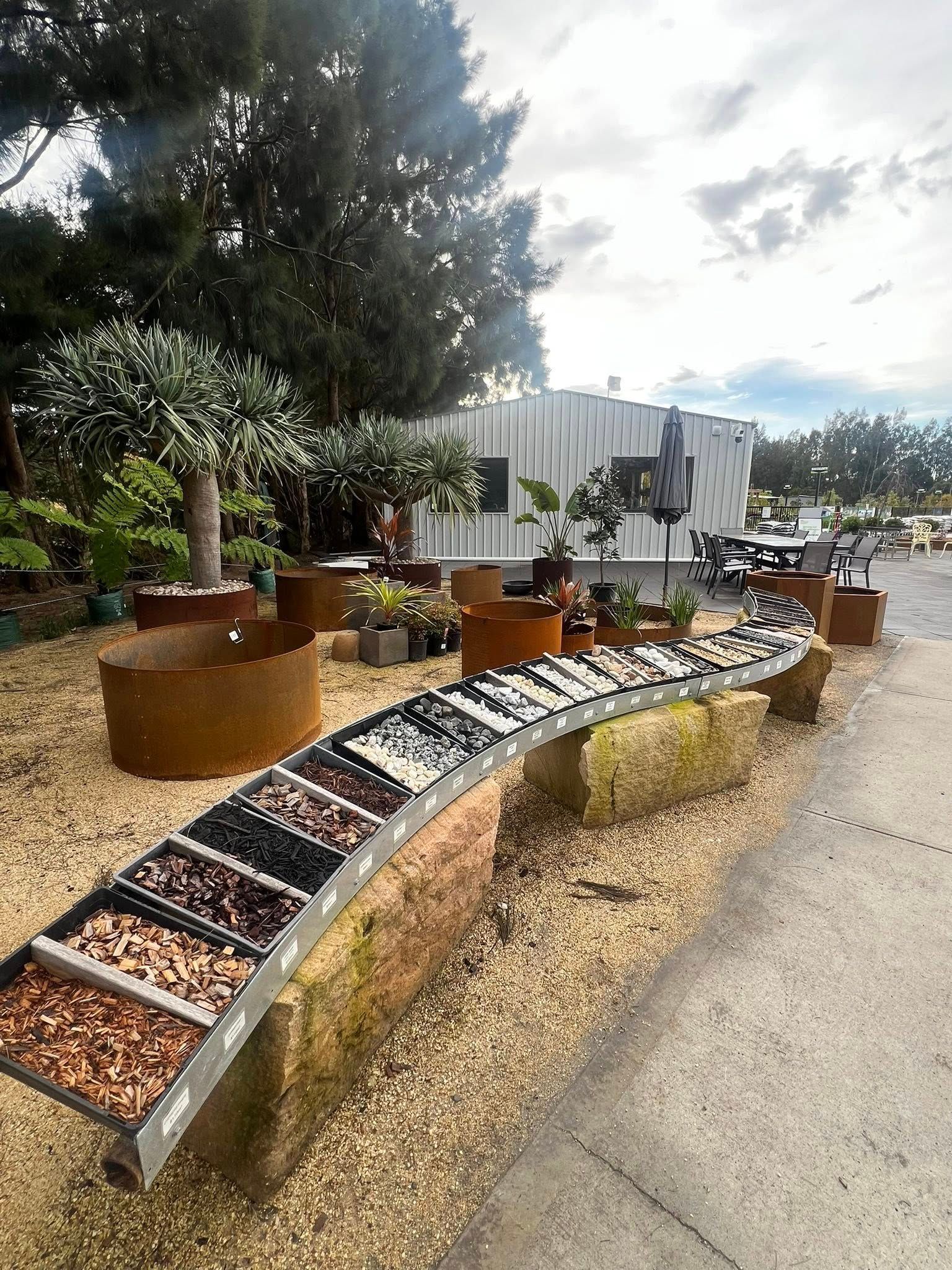 Garden Center with Gravel, Plants in Pots, and A Display of Stone Samples — Port Landscape Supplies in Port Macquarie, NSW
