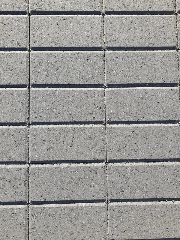 Grey Rectangular Pavers Arranged in a Grid Pattern, Creating a Textured Surface — Port Landscape Supplies in Port Macquarie, NSW